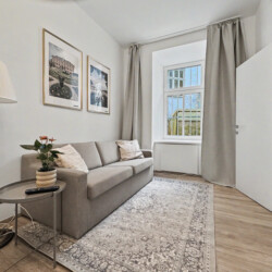 Comfortable double bed with modern bedding in ground floor Vienna Altbau apartment bedroom