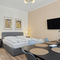 Entry area with coat hooks and storage in Vienna Altbau group apartment