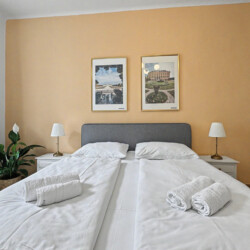 Sofa bed in living area providing extra sleeping space in Vienna Altbau group apartment