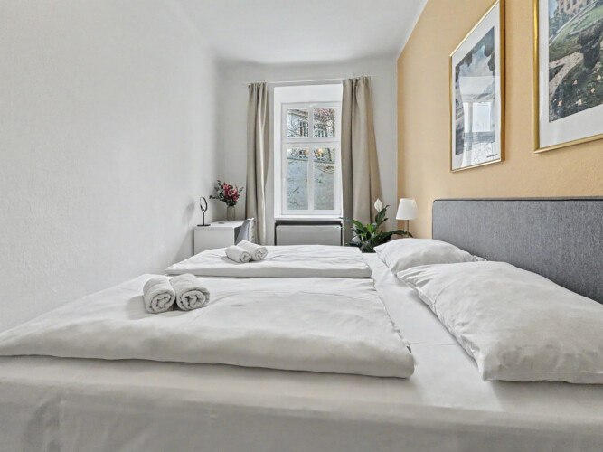 Bedroom furnishings with mirror and wardrobe in Vienna Altbau apartment