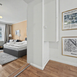Checkerboard black and white bathroom floor in elegant Vienna Altbau apartment